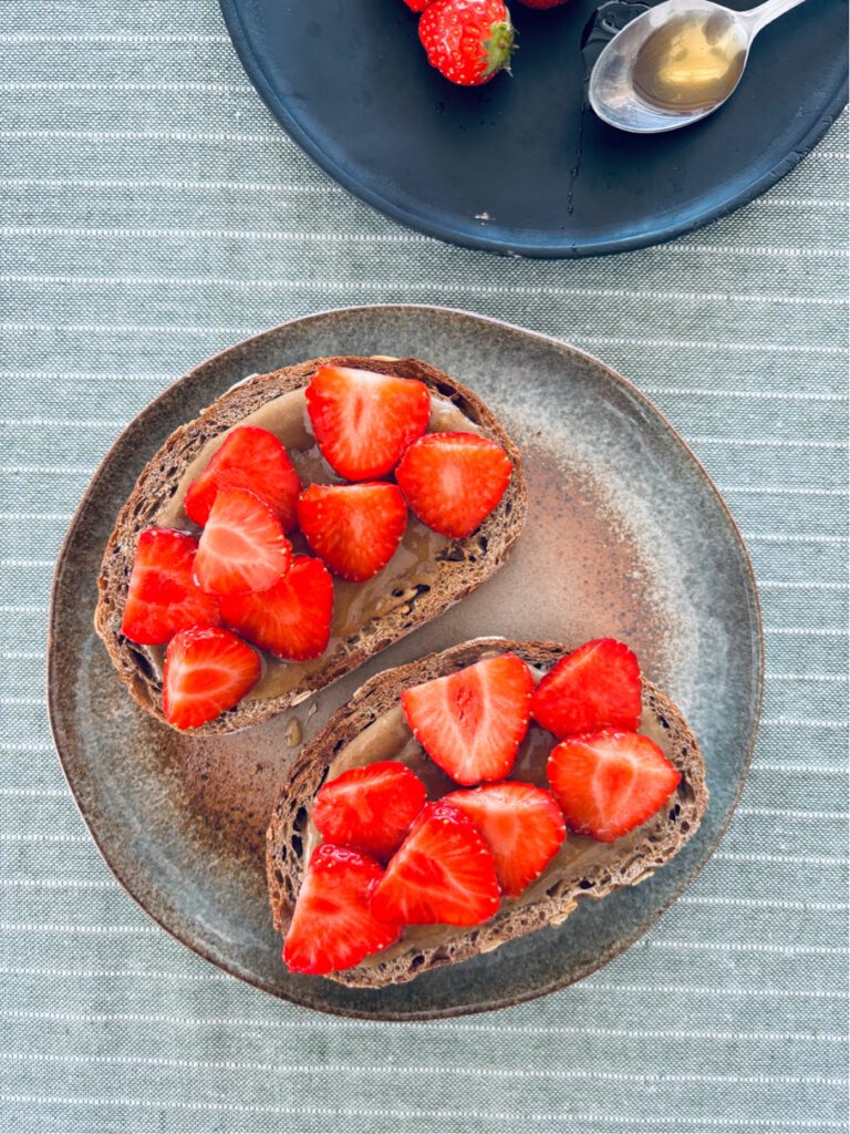 Tahini , honey + strawberries on toast