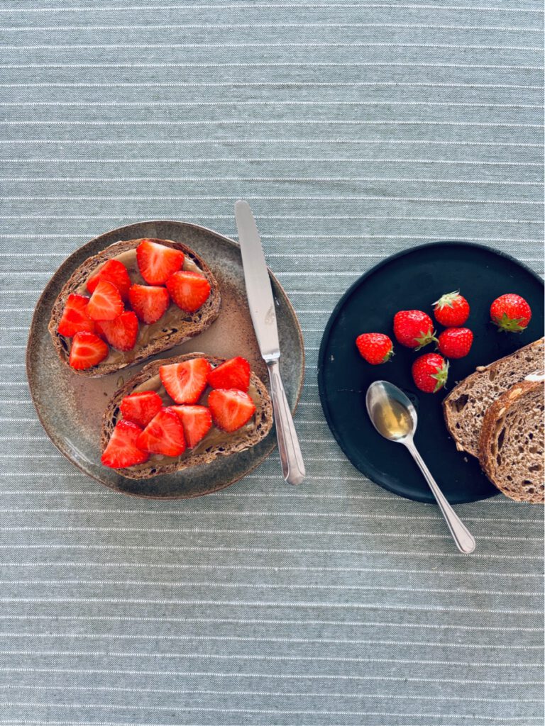 Tahini , honey + strawberries on toast