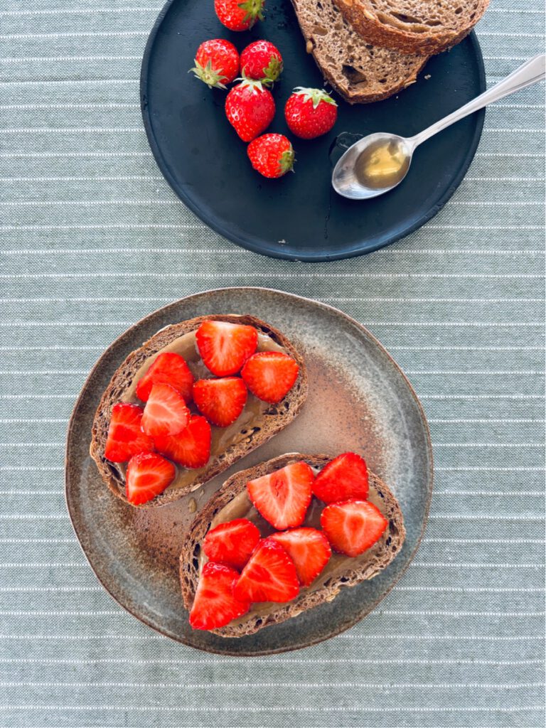 Tahini , honey + strawberries on toast