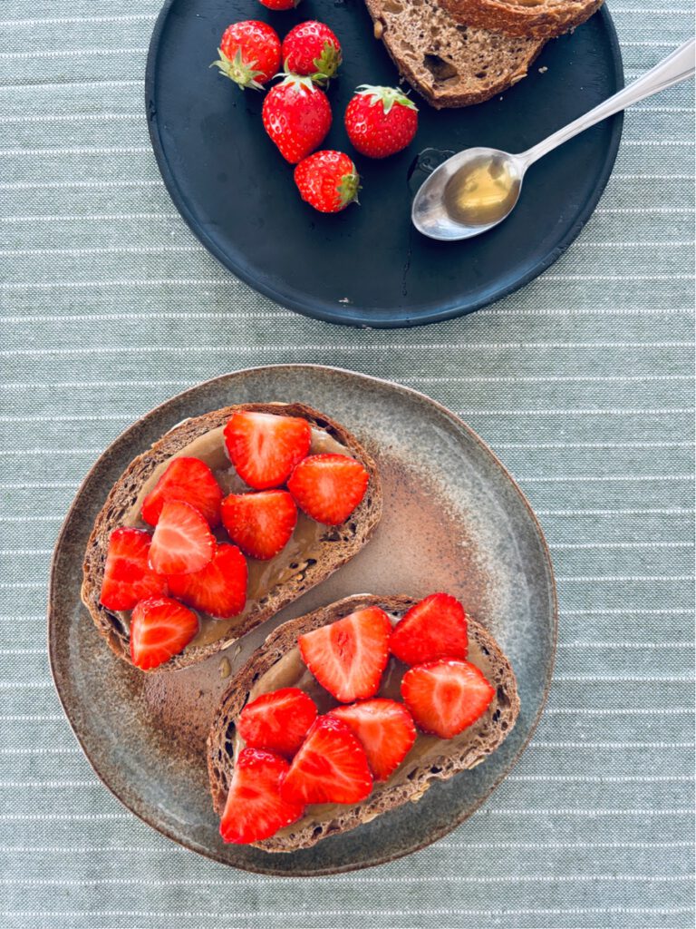 Tahini , honey + strawberries on toast