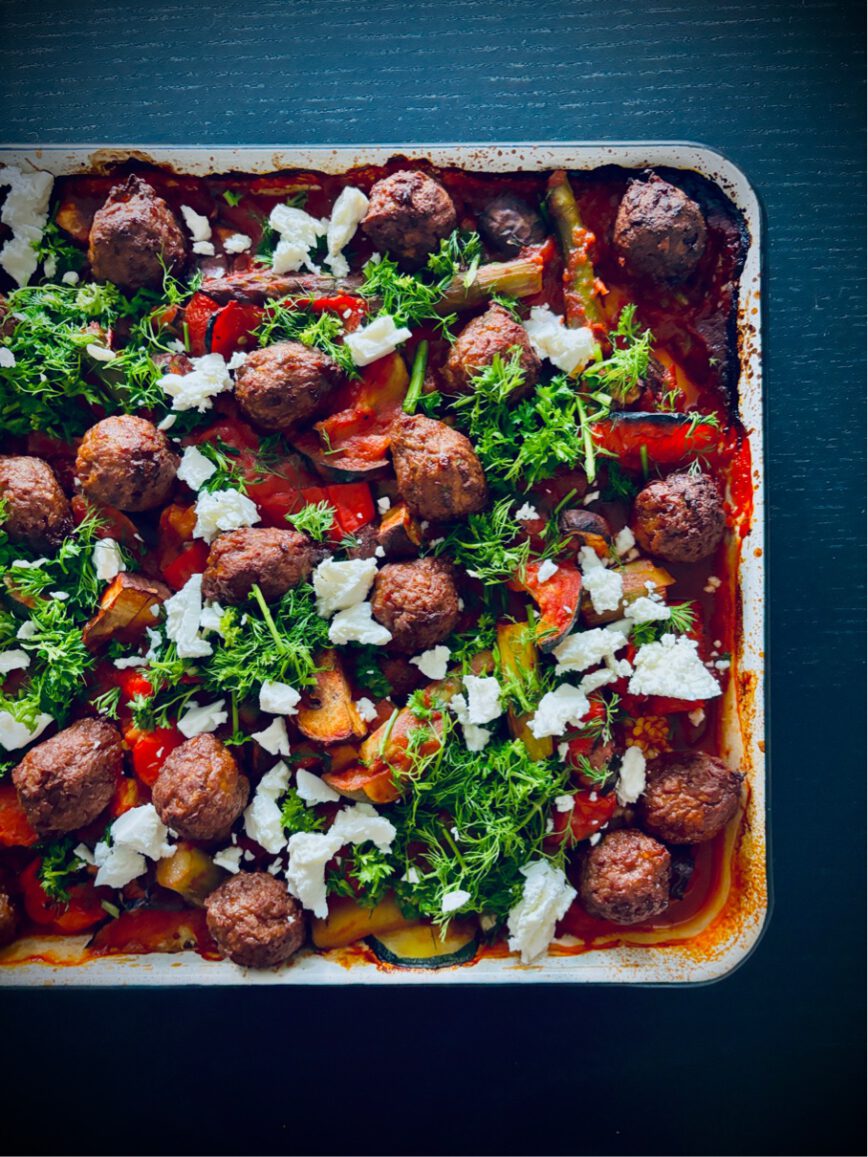 greek traybake veggies in tomato sauce and vegan meatballs