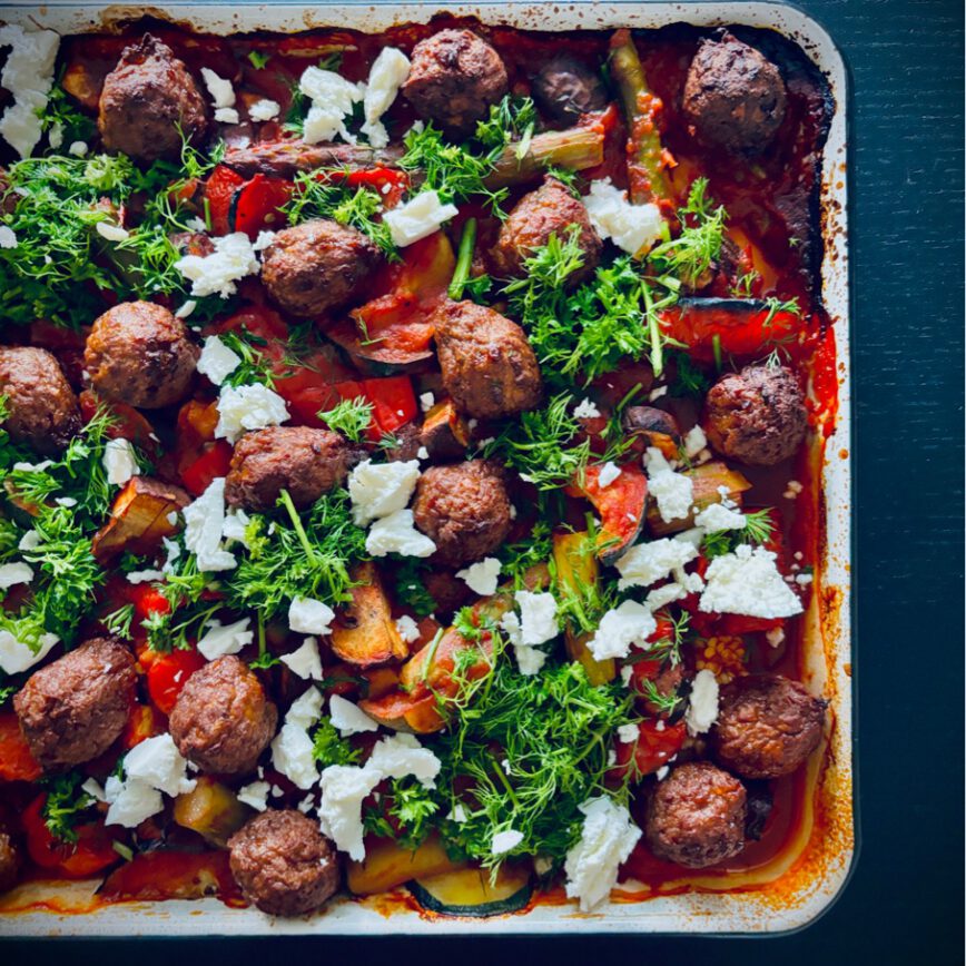 greek traybake veggies in tomato sauce and vegan meatballs