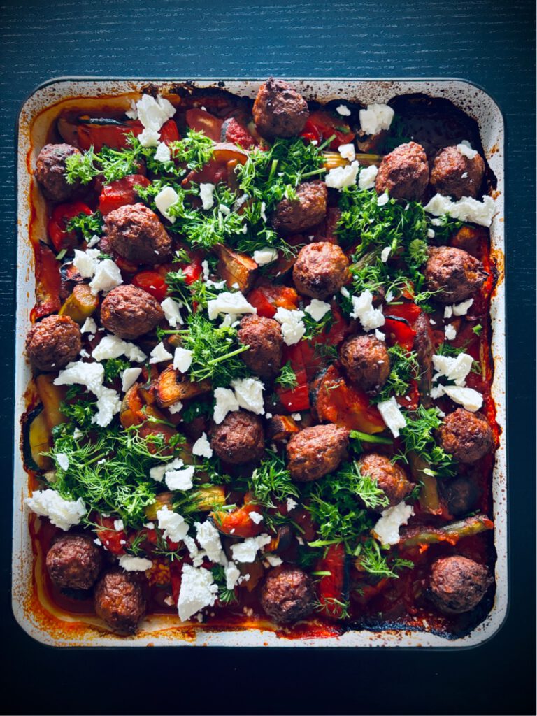 greek traybake veggies in tomato sauce and vegan meatballs